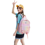 Happy Kid holographic pink school backpack worn by girl model β trendy kids school bag NZ with shiny finish and laptop pocket.