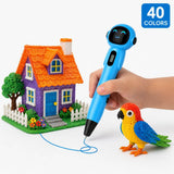 Blue cordless kids 3D pen with 40-colour PCL filament set — child drawing a colourful parrot and orange-roofed house