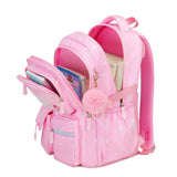 Girls school bag with front organiser and main compartment open, packed with books