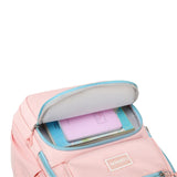 Lower compartment of pink girls school backpack – zip pocket for pens and supplies.