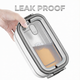 Hand holding the bento box sideways with liquid inside to demonstrate the leak-proof design and tight silicone seal.