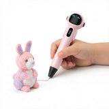Pink kids cordless 3D printing pen held in a small hand creating a cute animal figure