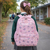 Pink school backpack worn by a student walking to school in New Zealand